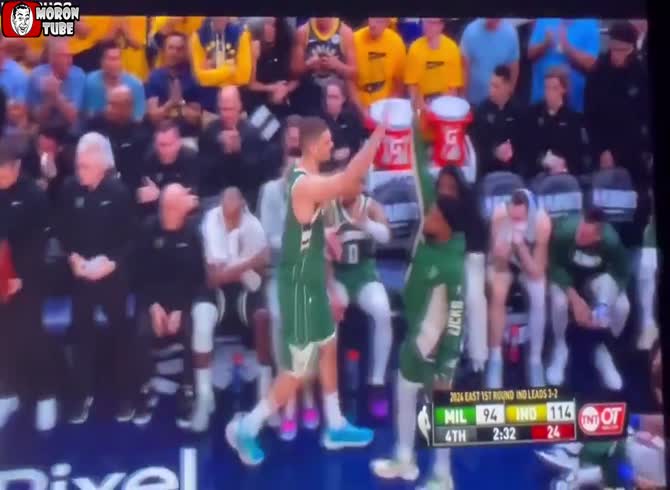 Video :A basketball player angrily tosses the ball toward two onlookers